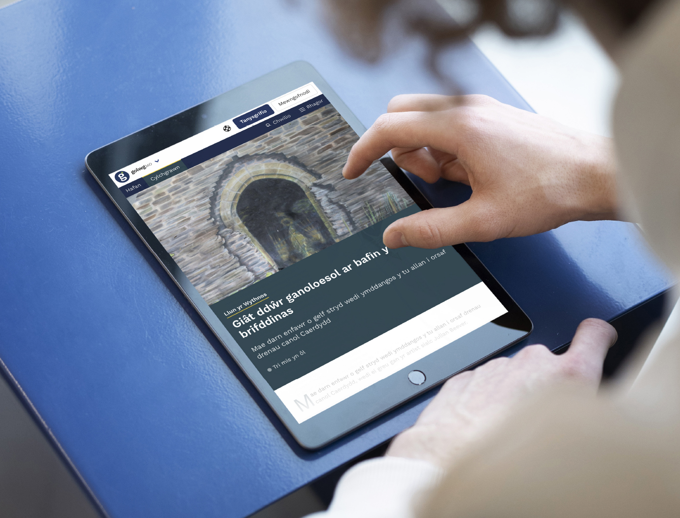 News article on tablet screen